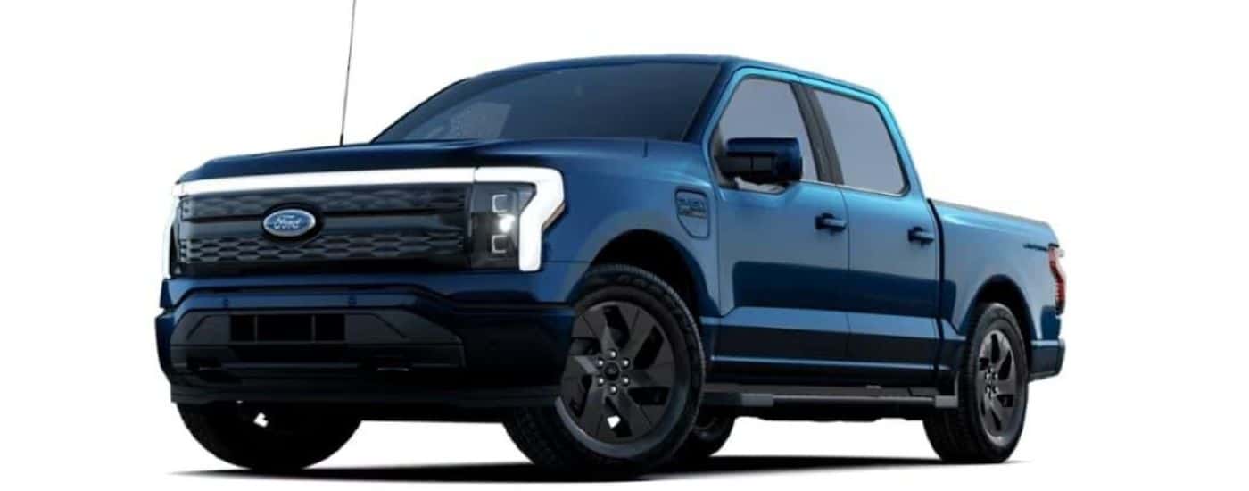 A blue 2023 Ford F-150 Lariat is shown angled left.