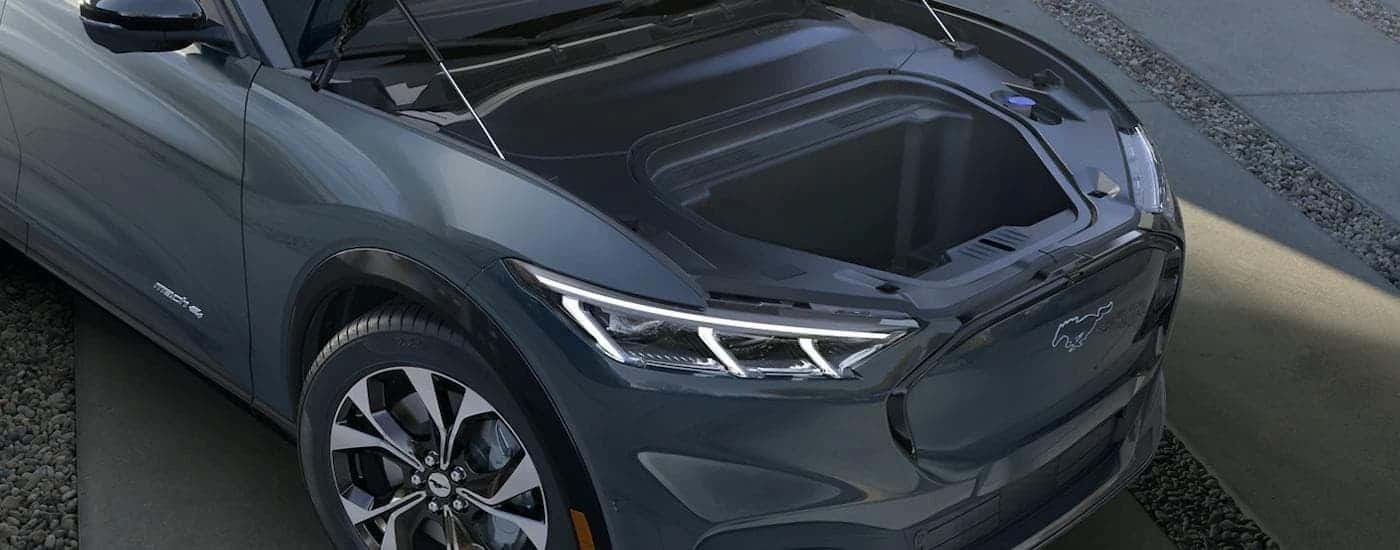 A view of the frunk in a grey 2023 Ford Mustang Mach-E is shown.