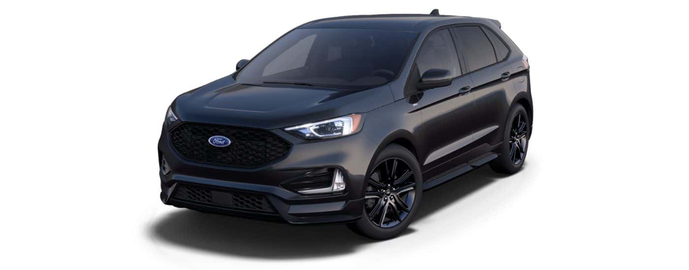 A black 2024 Ford Edge ST-Line is angled left.