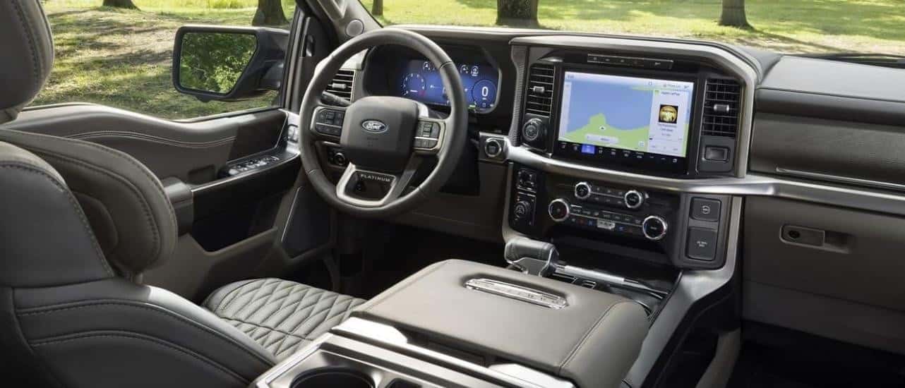 The gray dash and infotainment screen are shown in a 2024 Ford F-150 Platinum.