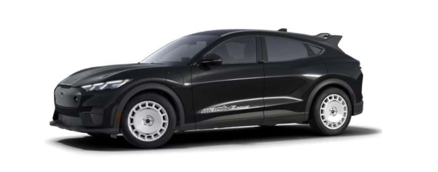 A black 2024 Ford Mustang Mach-E Rally is angled left.