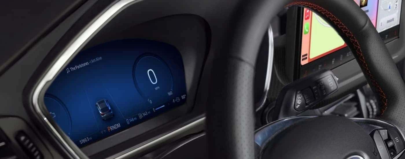 A close up of the steering wheel in a 2025 Ford Escape.