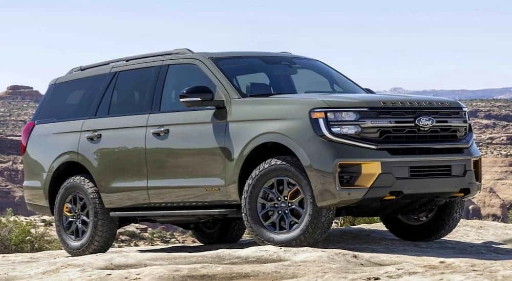 A green 2025 Ford Expedition Tremor is parked on a rock after leaving a Ford dealer near Decatur.