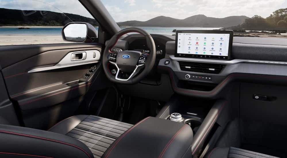 The black interior and dash are shown in a 2025 Ford Explorer Active.