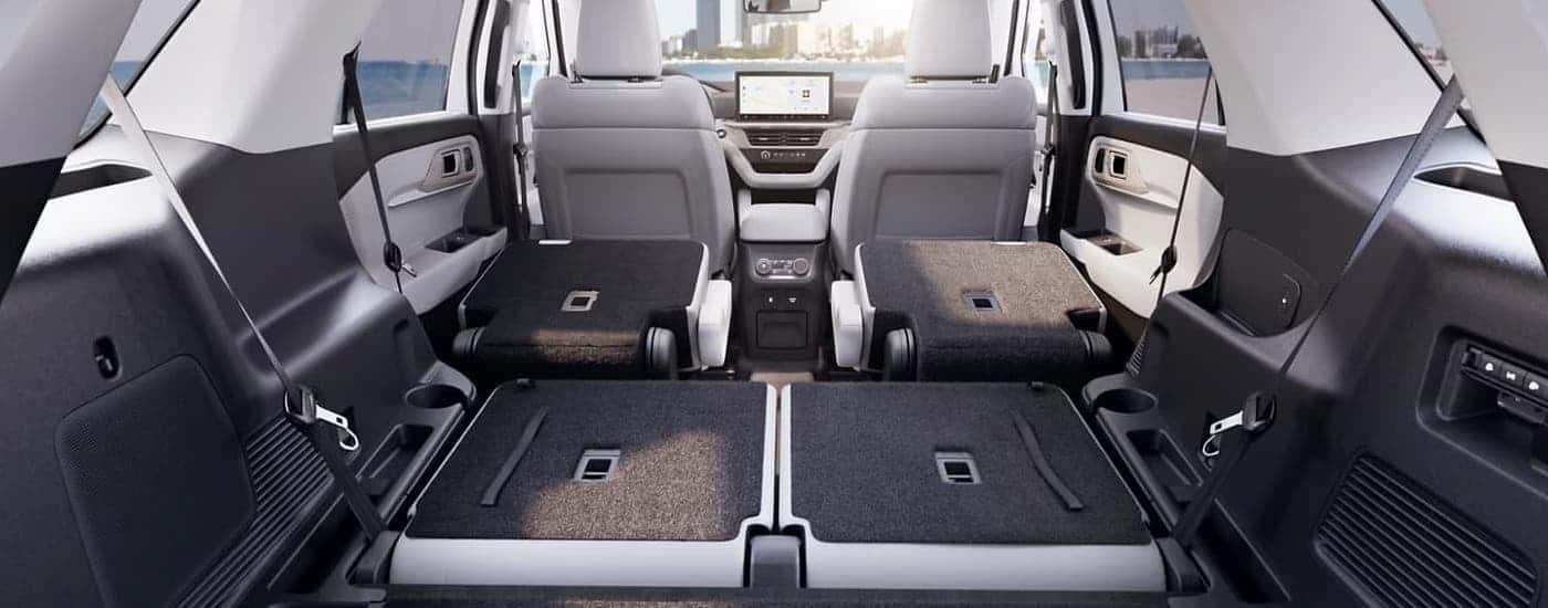 The rear seating is folded down in a 2025 Ford Explorer.