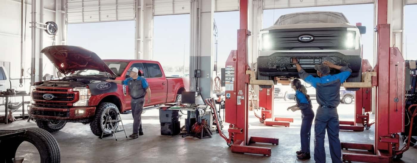 Technicians are shown performing auto repair near Snellville.