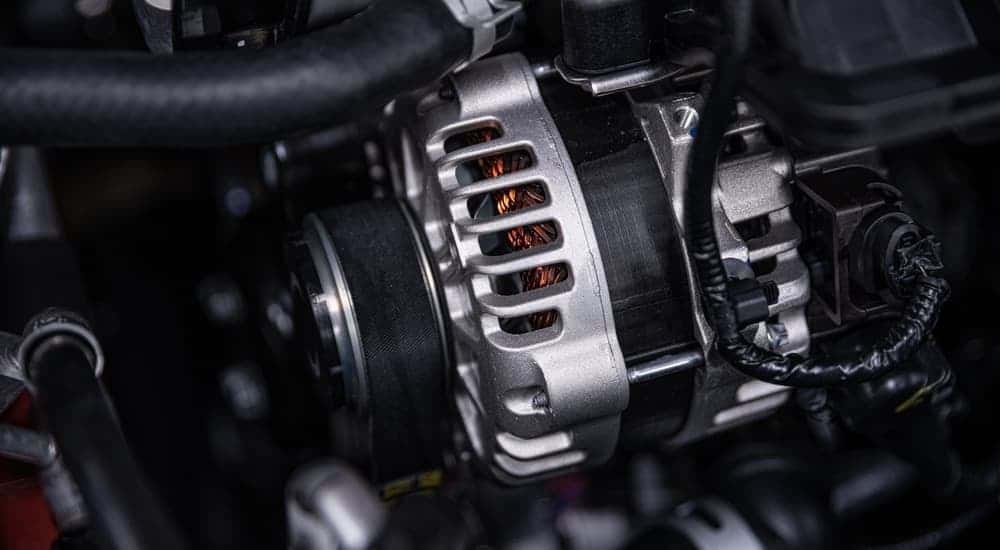 Close-up of an alternator in a car.