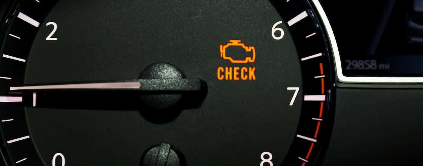 A close up of a check engine light during a diagnostics test.