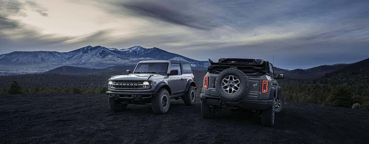 Two grey 2024 Ford Broncos are parked on gravel after leaving a Ford dealer near Decatur.