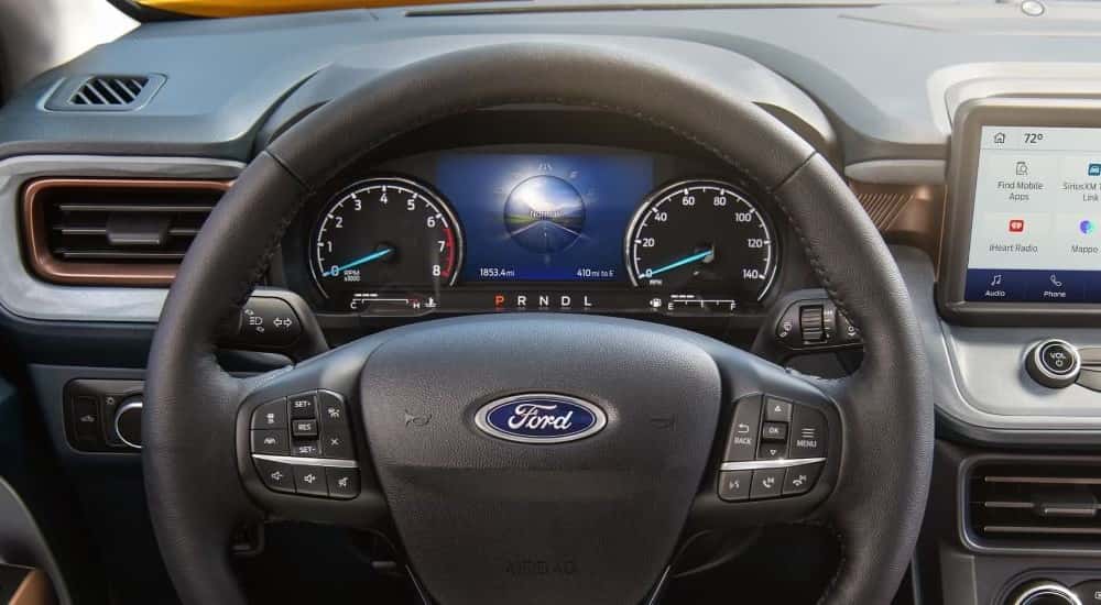 The steering wheel and digital displays in a 2024 Ford Maverick for sale.