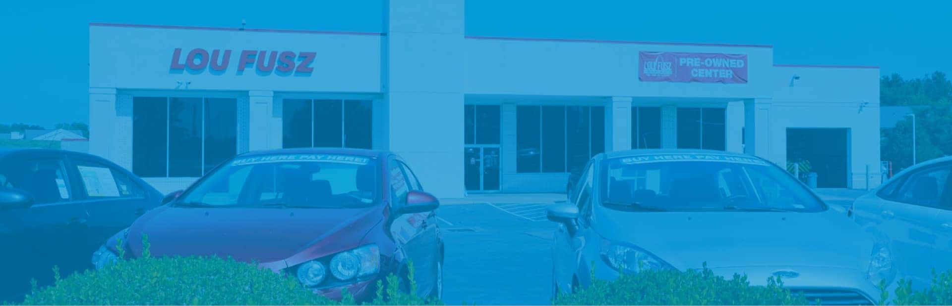 Photo of Lou Fusz dealership with blue filter