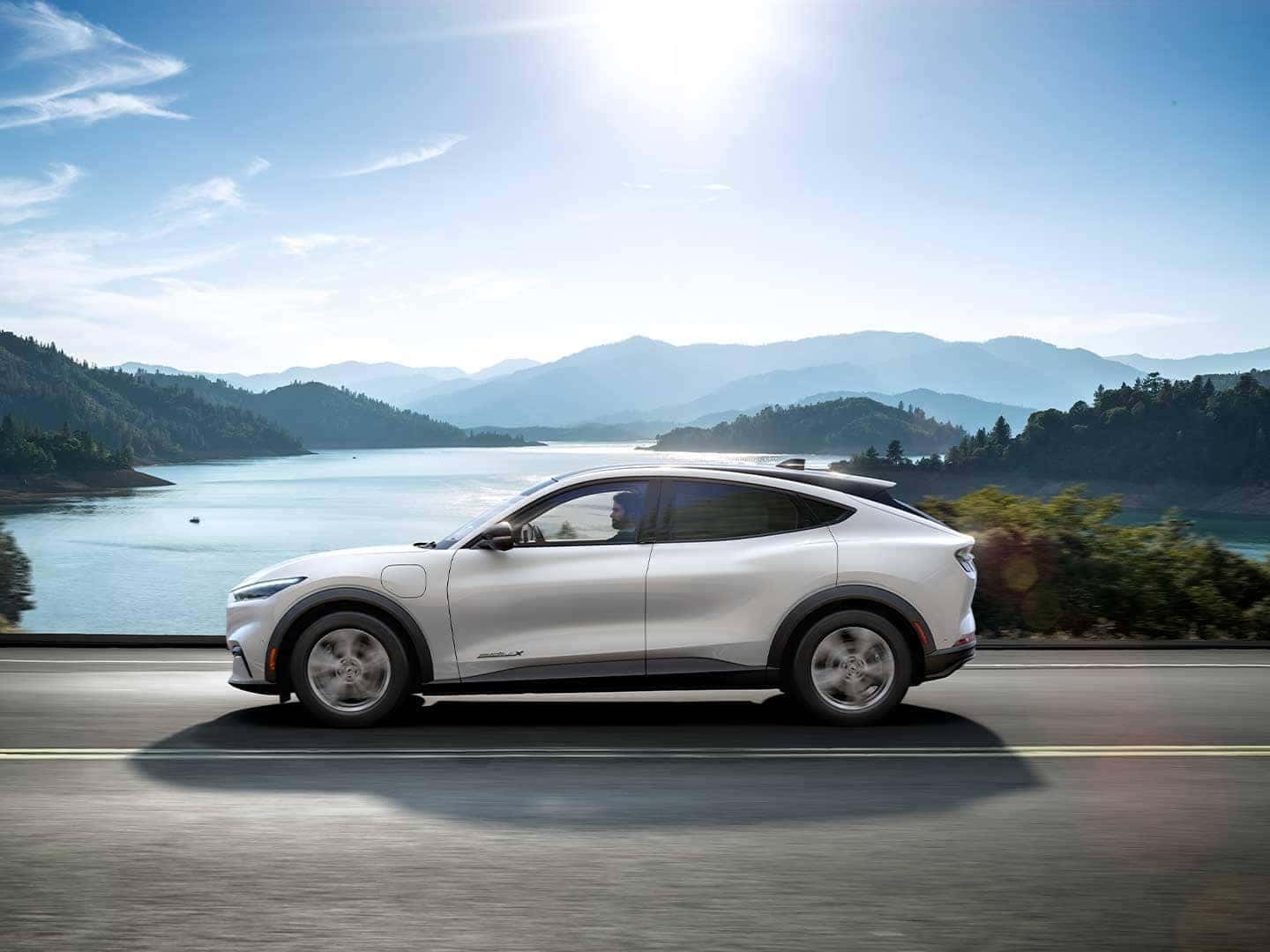 2021 Ford Mach-E driving along lake