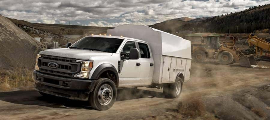 Ford Commercial Truck driving up dirt road