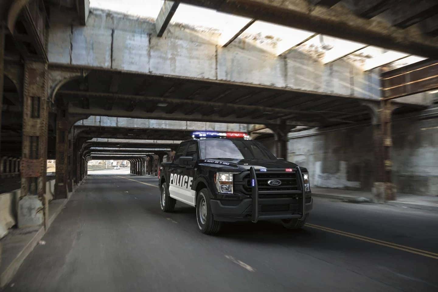 Ford F-150 Police Responder driving under overpass