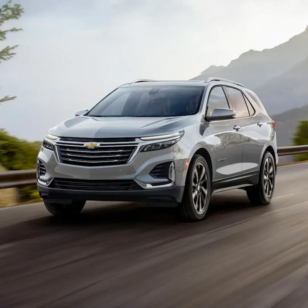 2024 Chevrolet Equinox driving down the road