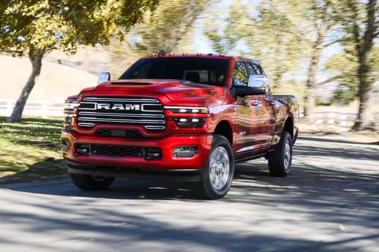2026-ram-2500-red-drives country road