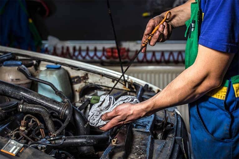 Mechanic-Checking-Oil-with-Rag-Mobile