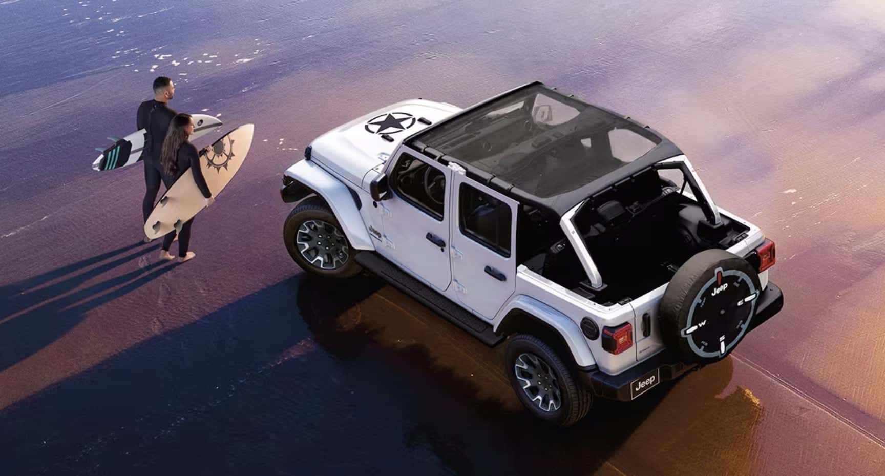white jeep wrangler on the sand