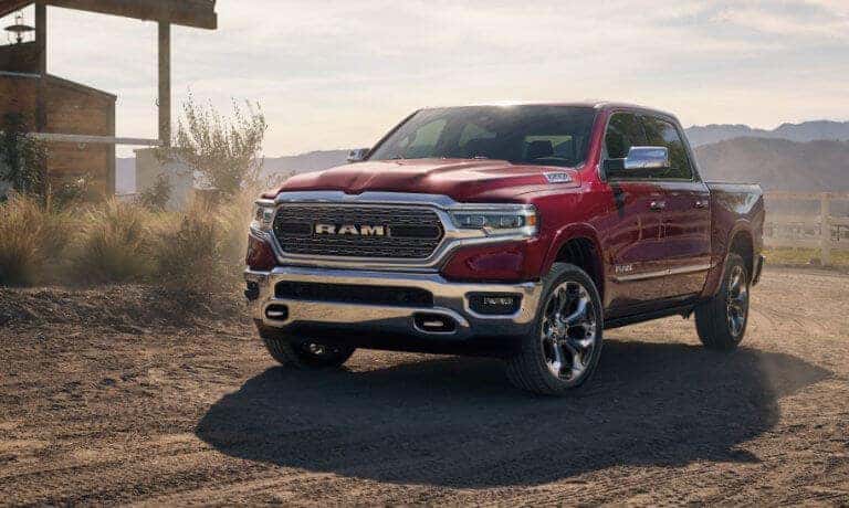 2019 Ram 1500 A red 2019 Ram 1500 driving on a farm