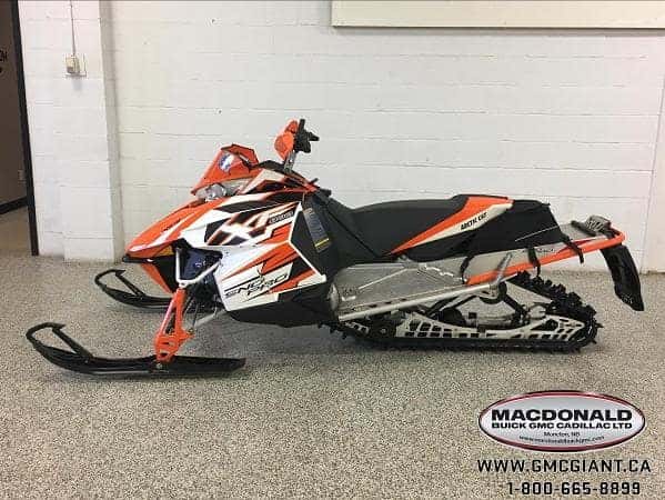 macdonald powersports image - orange snow mobile