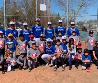 Group photo of people in baseball uniforms