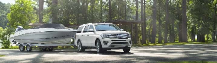 Ford-towing-a-boat-in-the-back