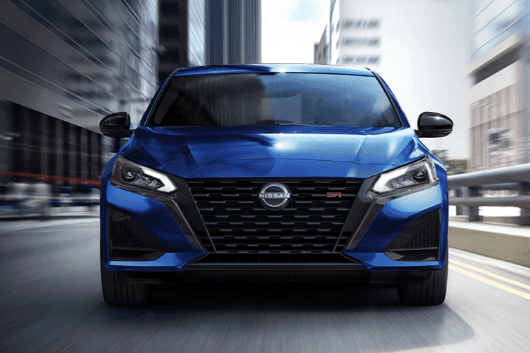 2023 blue Nissan Altima front-view-city-street