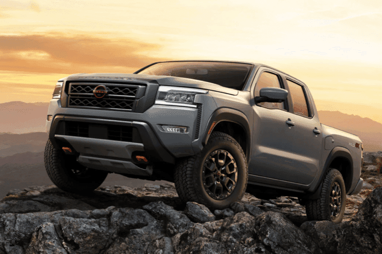 2023 gray-nissan-frontier-side-view-on-mountain