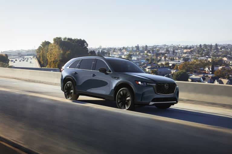 2026-CX-90-speeds-along-highway-mobile