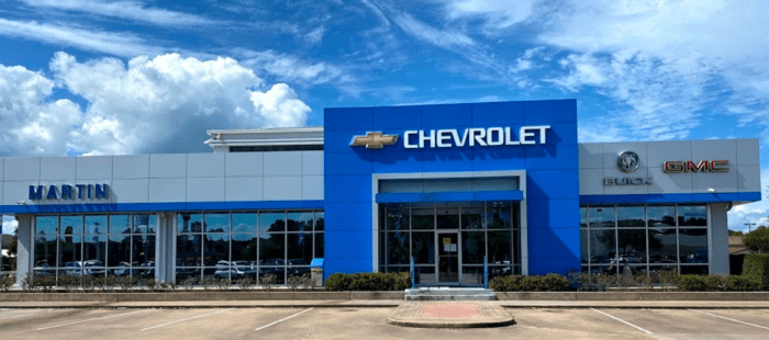 An exterior shot of a Chevrolet dealership during the day.