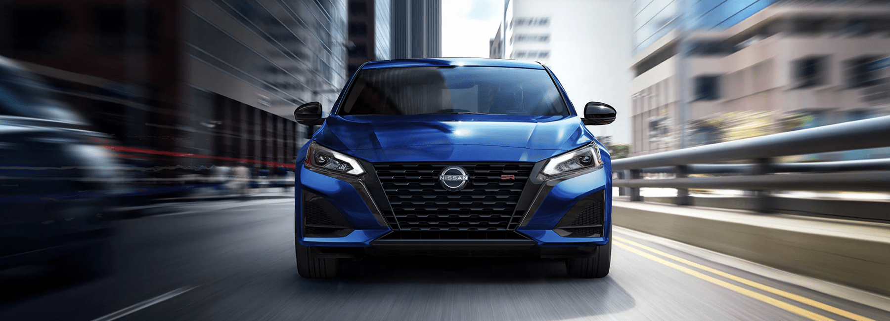 2023 blue Nissan Altima front-view-city-street