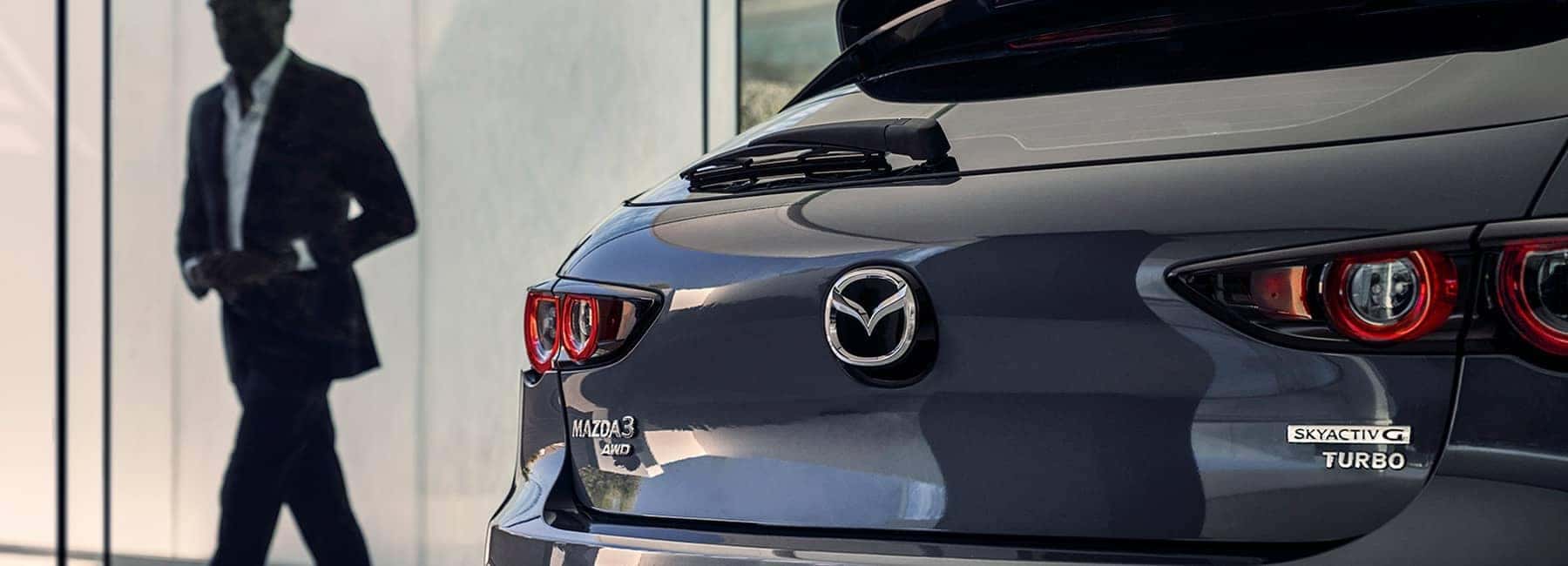 2022 Mazda 3 hatchback back with person in background