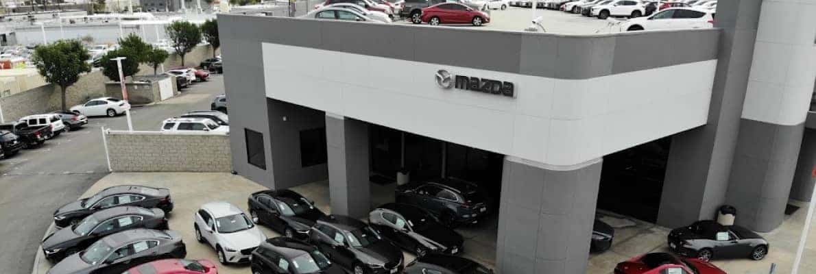 Mazda of Orange dealership exterior and parking lot.