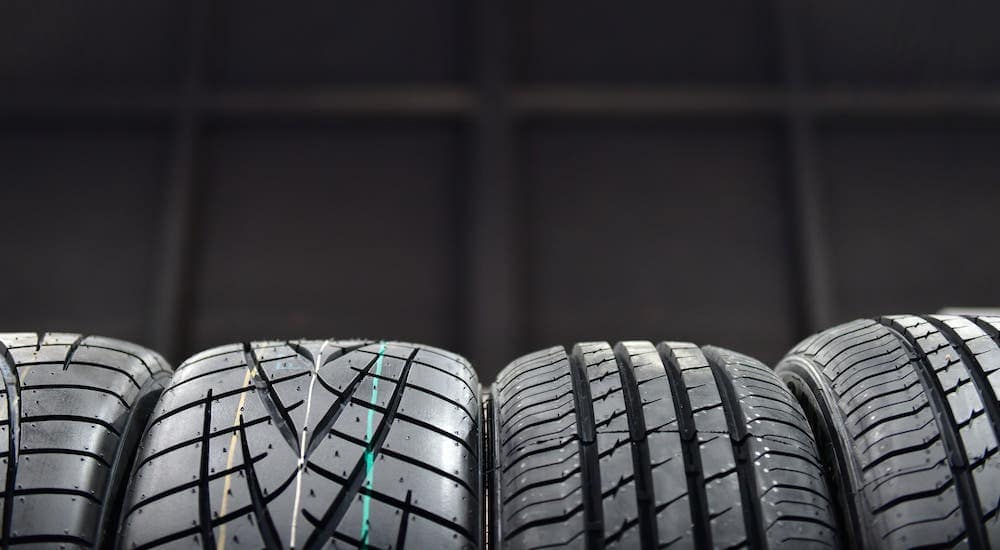 A row of tires are shown on the bottom half of the image in a Cincinnati tire shop.