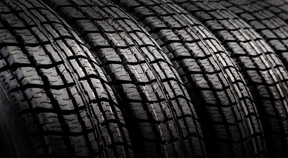 A closeup shows several tires.