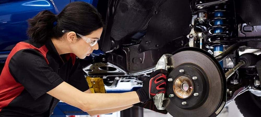 Mechanic Working on Wheel