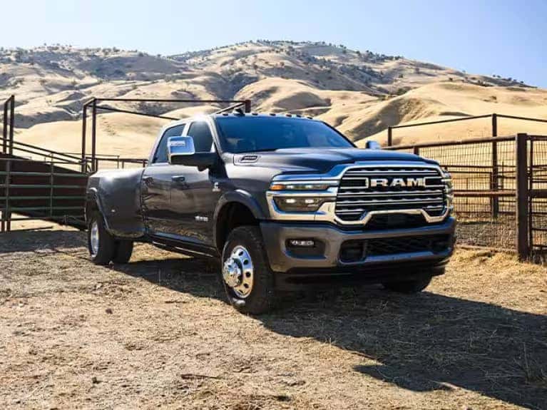 2025 RAM 3500 angled view by a gate