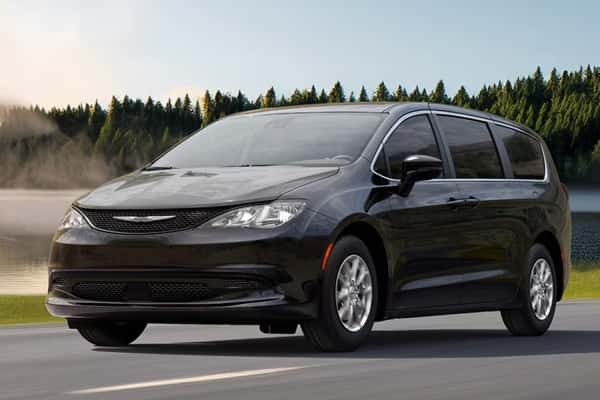 2026-Chrysler-Voyager-in-front-of-a-forest-lake-with-steam-rising-off-it