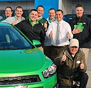 McGrath Team in front of green car