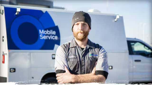 Mobile Service technician with arms crossed