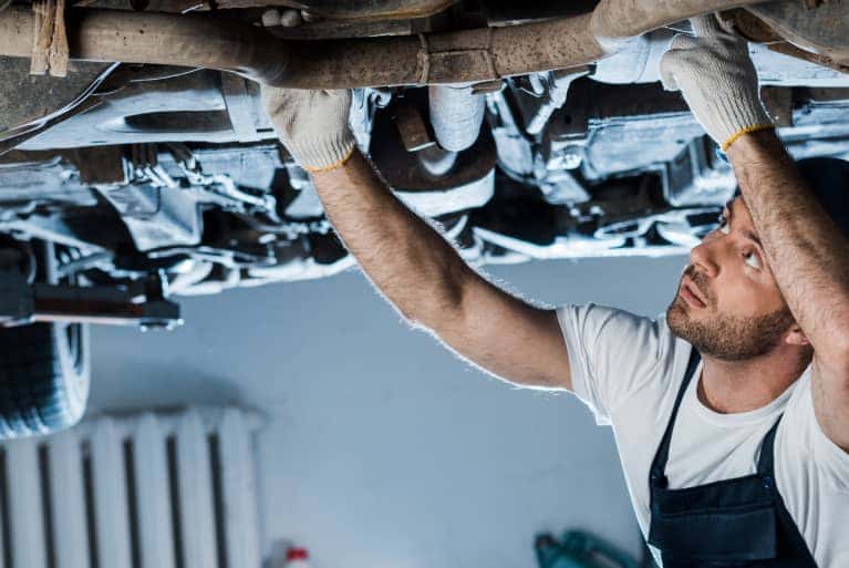 service-specialist-looking-at-undercaggiage-mobile