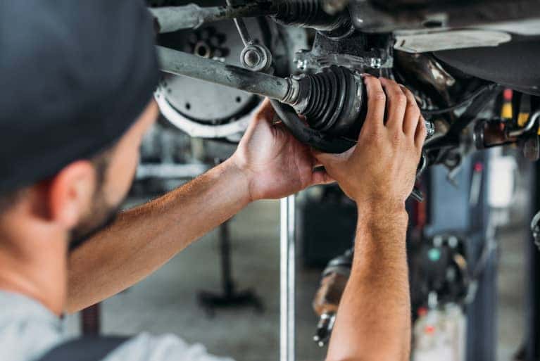 service-specialist-working-on-vehicle-mobile