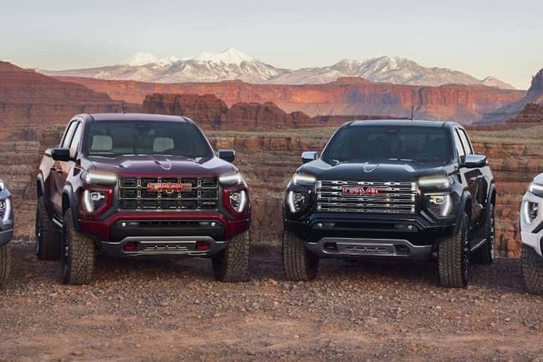 Group-of-2023-GMC-Canyon-trucks-parked-on-dirt-road_mobile