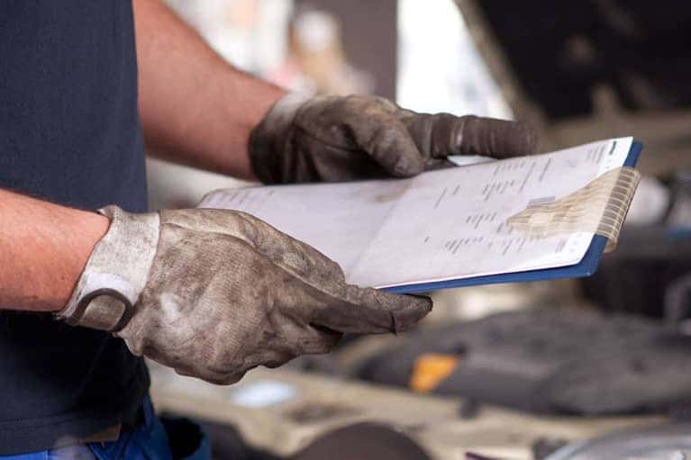 Mechanic with Vehicle Inspection Checklist