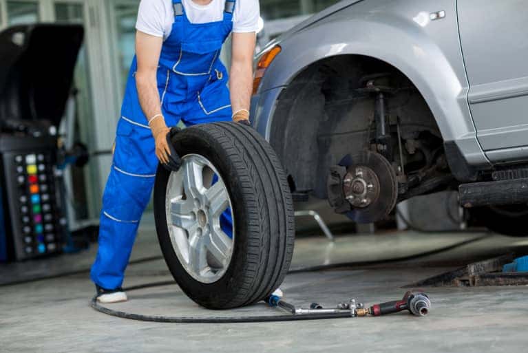 Mechanic installing a tire