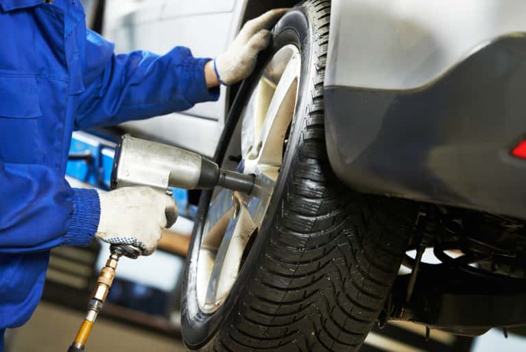 Service technician working on tires