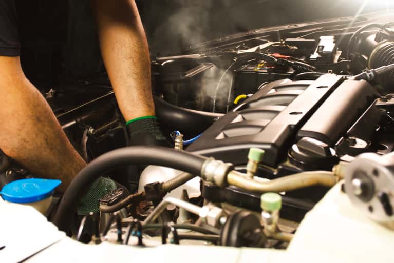 Mechanic looking at an engine