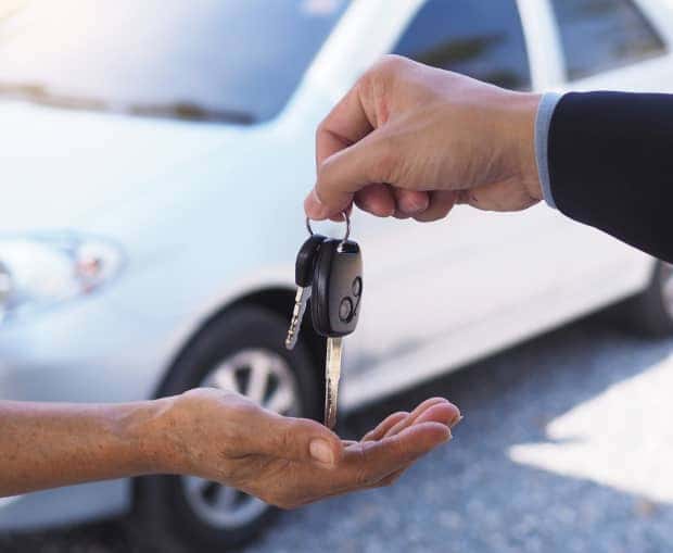 Handing car keys to another person
