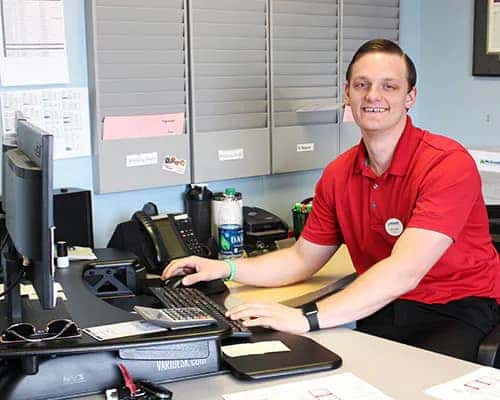 McGrath Finance Team Member in red shirt