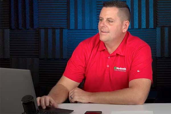 McGrath employee in a red shirt